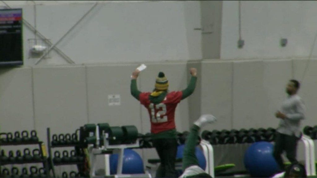 Rodgers dancing inside the training facility