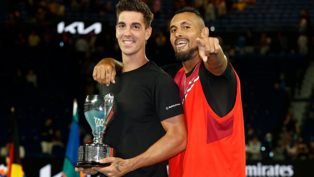 Thanasi Kokkinakis and Nick Kyrgios with the 2022 Australian Open trophy