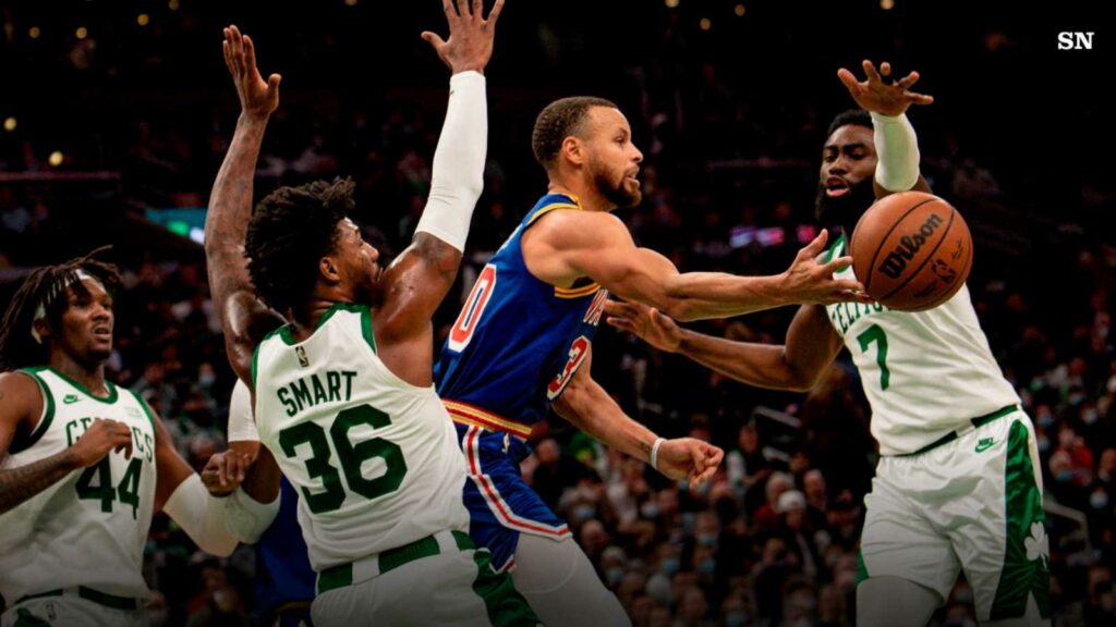 Stephen Curry guarded by Boston Celtics