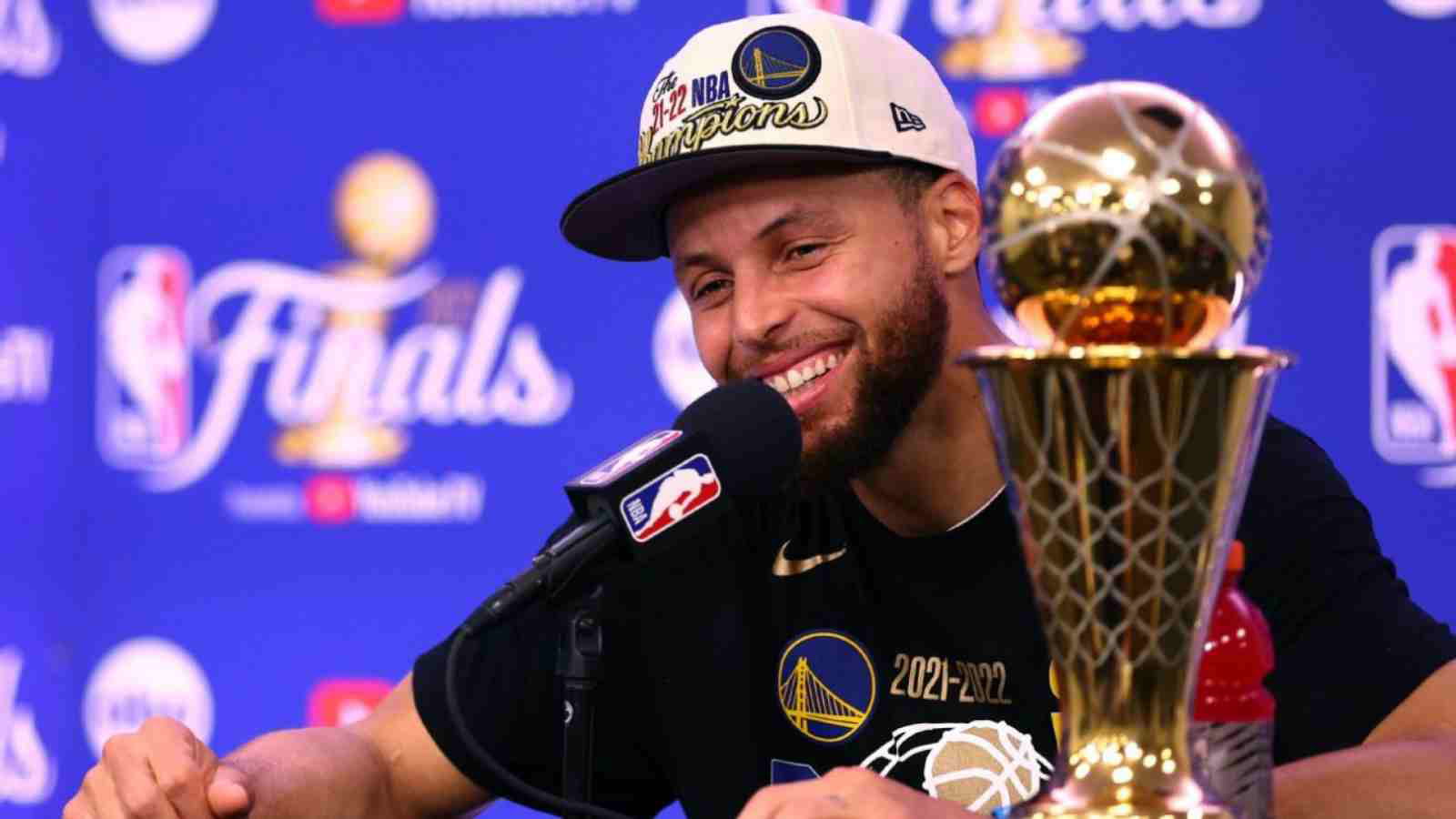 Stephen Curry with the FMVP trophy in 2022