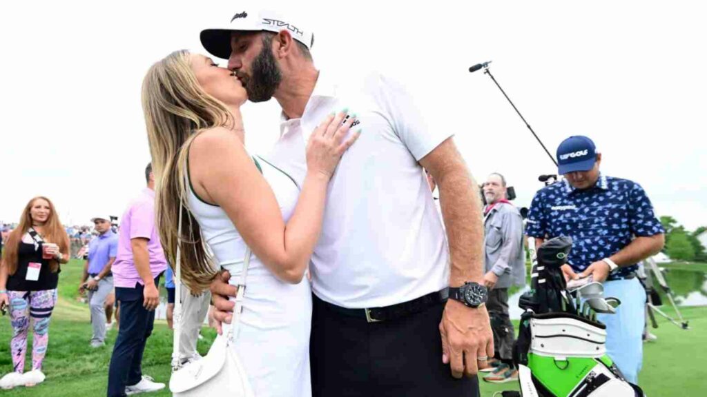 Dustin Johnson kisses Paulina Gretzky