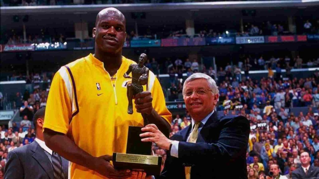 Shaquille O'Neal with the MVP trophy in 2000