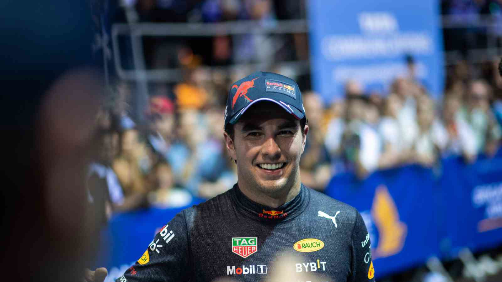 Red Bull racer Sergio Perez walks into the Mexican GP after attaining a huge record for his home country