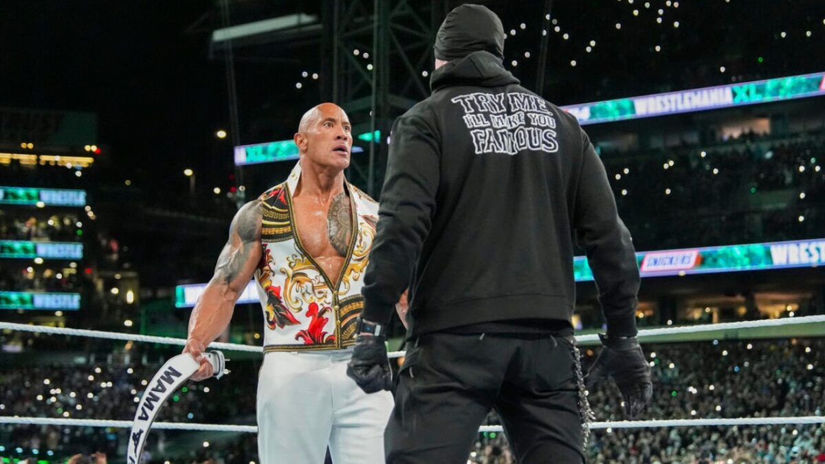 WATCH: The Undertaker goes off on legendary boxer Evander Holyfield's son for wearing jewelry during WWE match 4 The Rock and The Undertaker