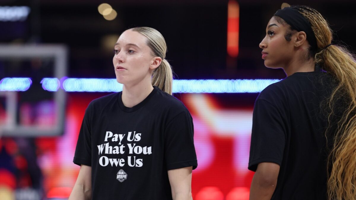 "Whatever it Takes" Angel Reese Fires Warning to WNBA Owners Amid CBA Negotiations 1 Angel Reese and Paige Bueckers wearing the 'pay us' t-shirts