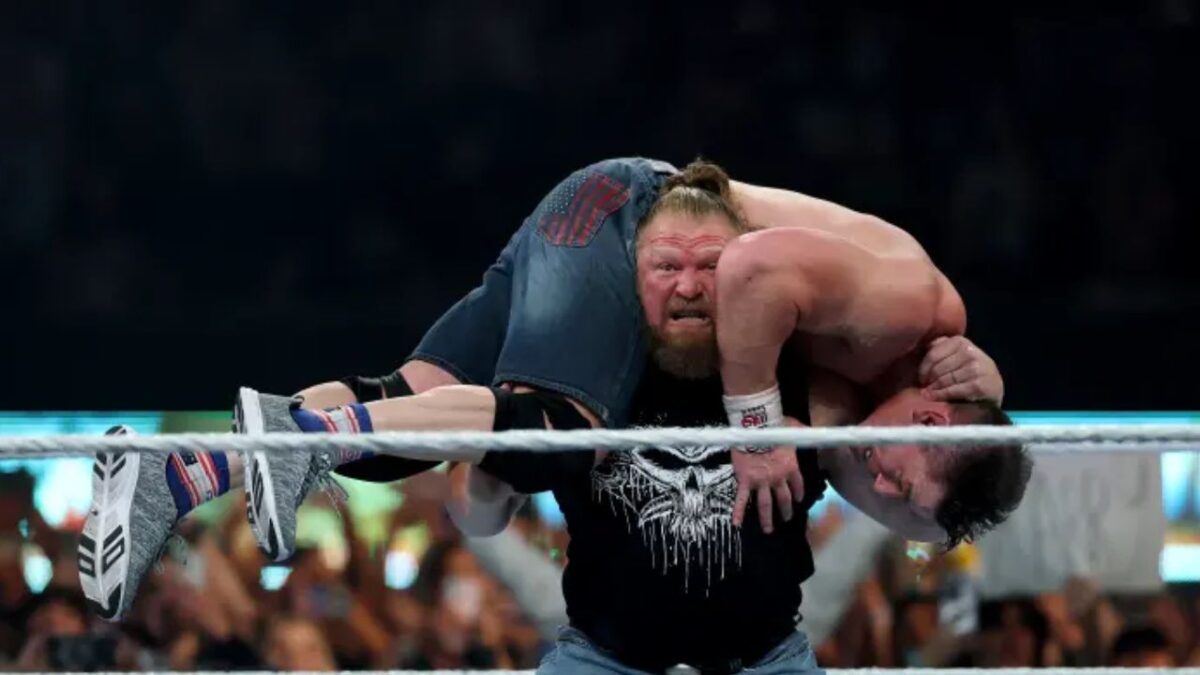 Brock Lesnar with John Cena up on his shoulders