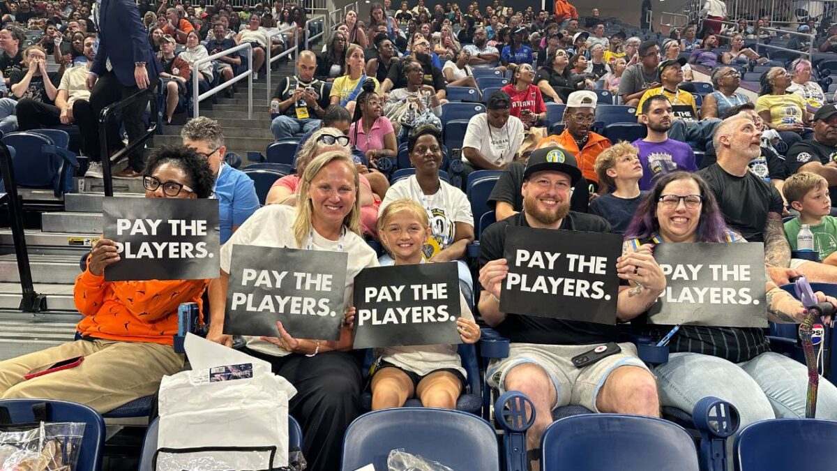Sky fans with 'Pay the players' cards