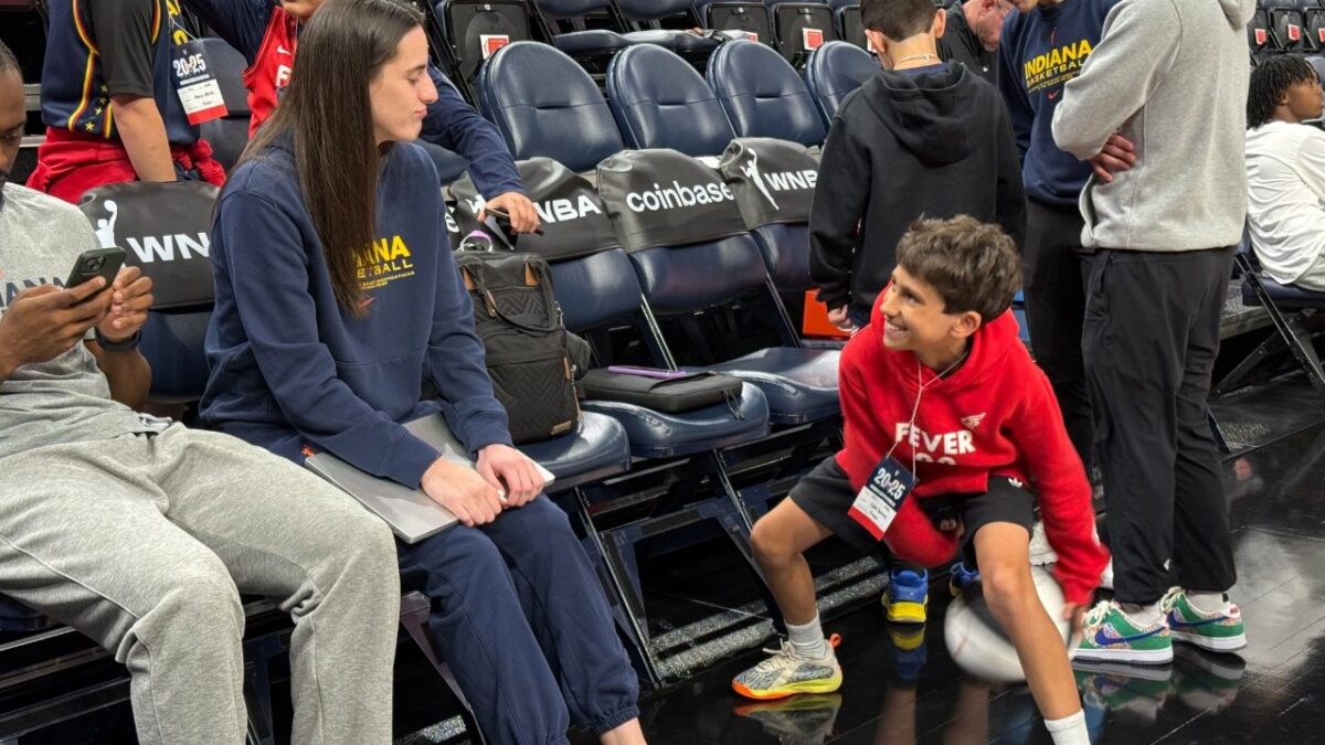Kids Grill Caitlin Clark With 'Hardest Questions Ever Asked' and Teach Her About Animals 1 Caitlin Clark with head coach Stephanie White's son