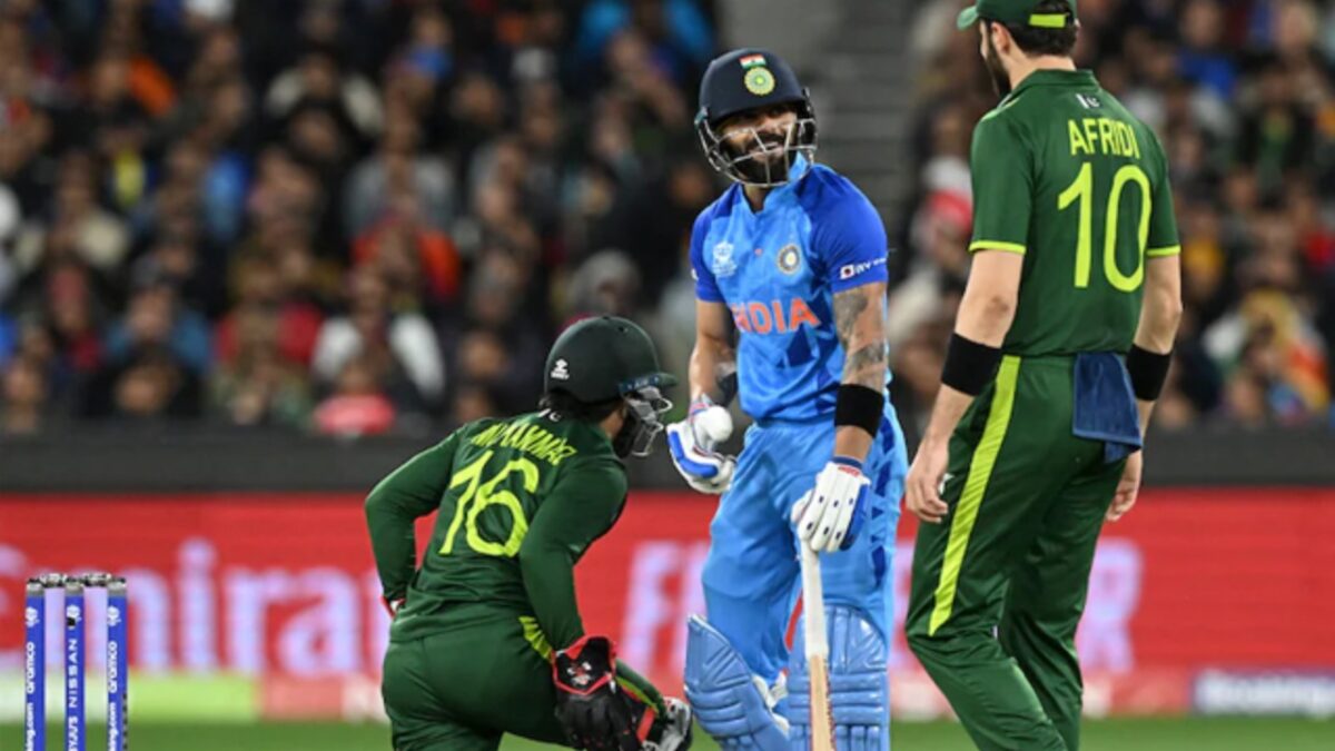 Virat Kohli and Pakistan players engage in conversation during T20 World Cup match in 2022.