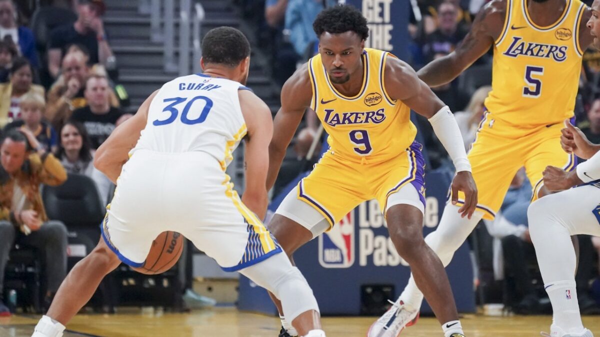 Stephen Curry being guarded by Bronny James