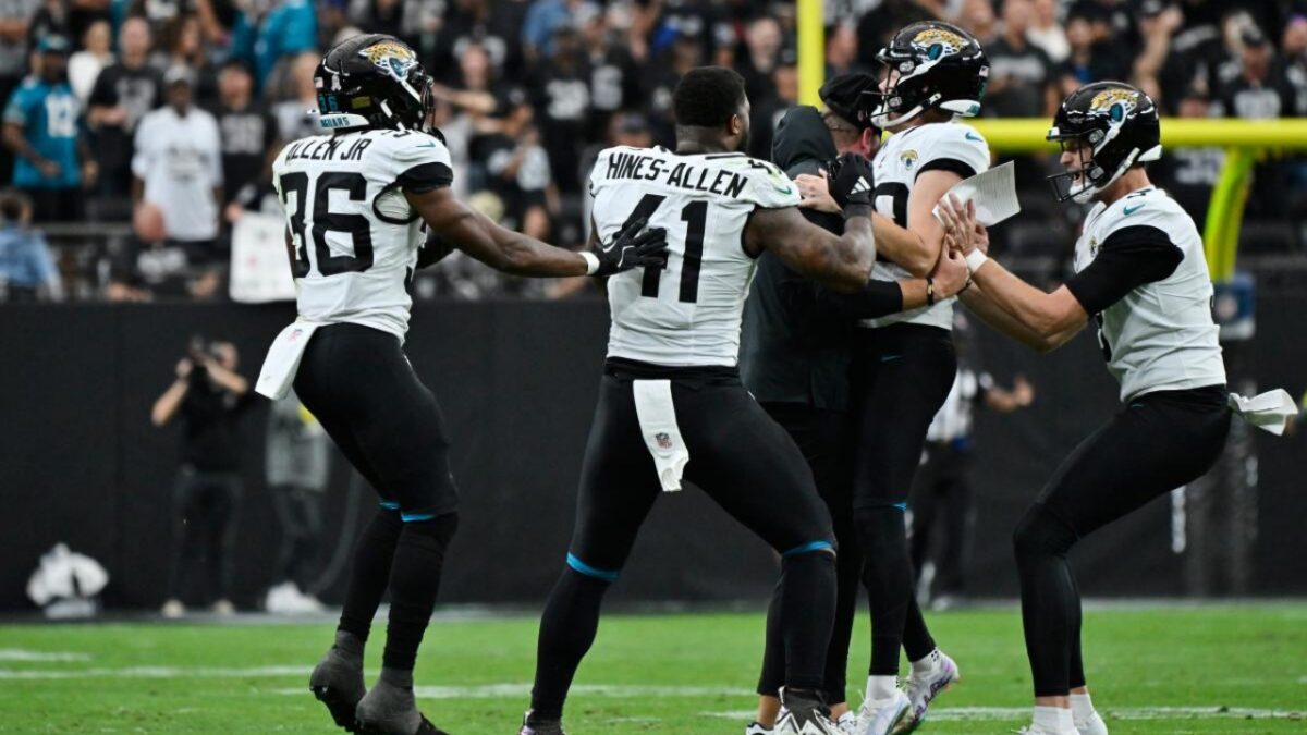 Jaguars players celebrate with Cam Little after record-setting field goal