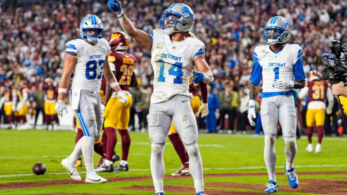 Amon-Ra St. Brown pointing at Donald Trump's suite after touchdown