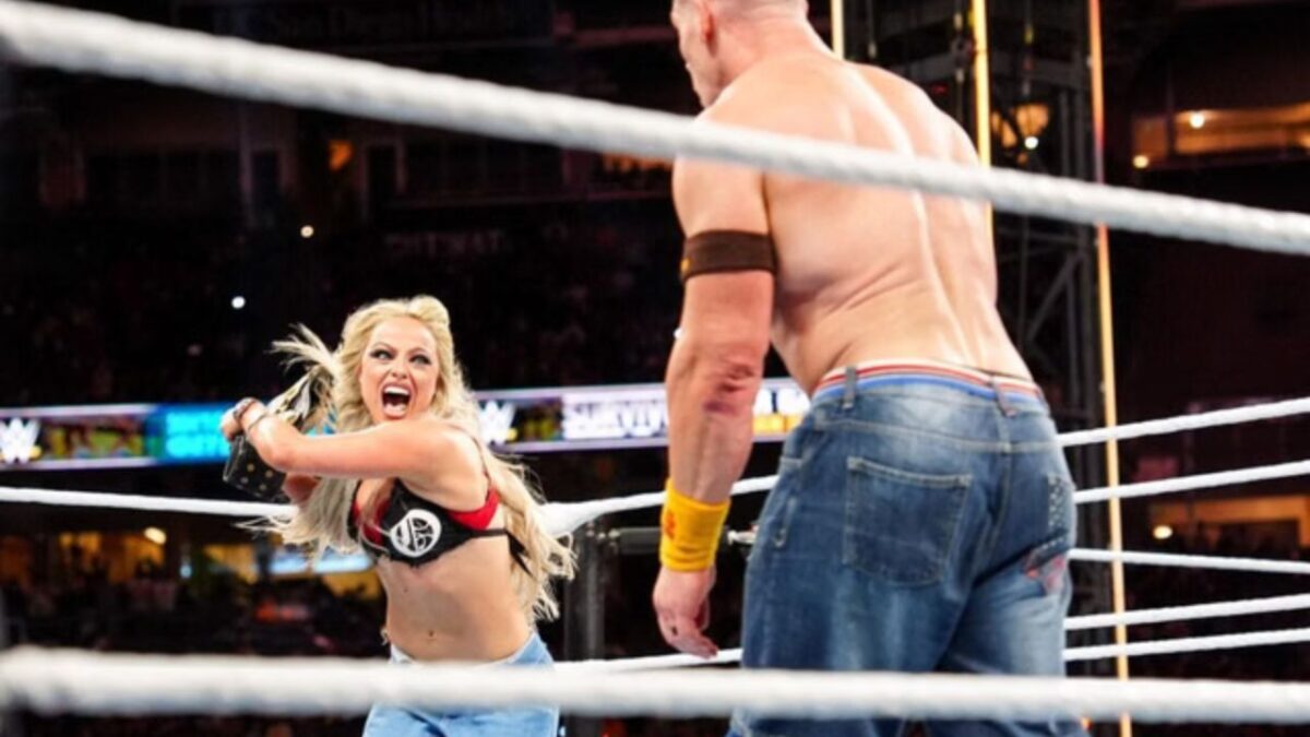Liv Morgan attacking John Cena at Survivor Series WarGames
