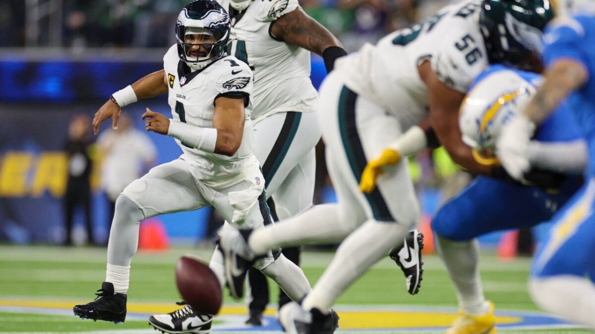 Jalen Hurts chasing his fumble