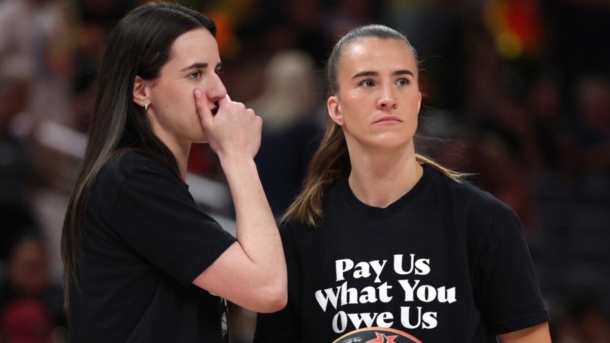 Caitlin Clark and Sabrina Ionescu with the 'Pay Us' T-shirts