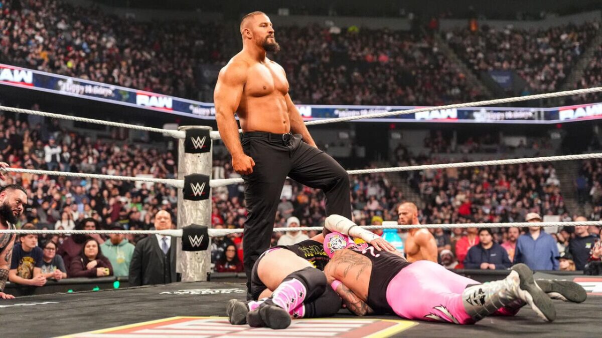 Bron Breakker standing tall over CM Punk and Rey Mysterio