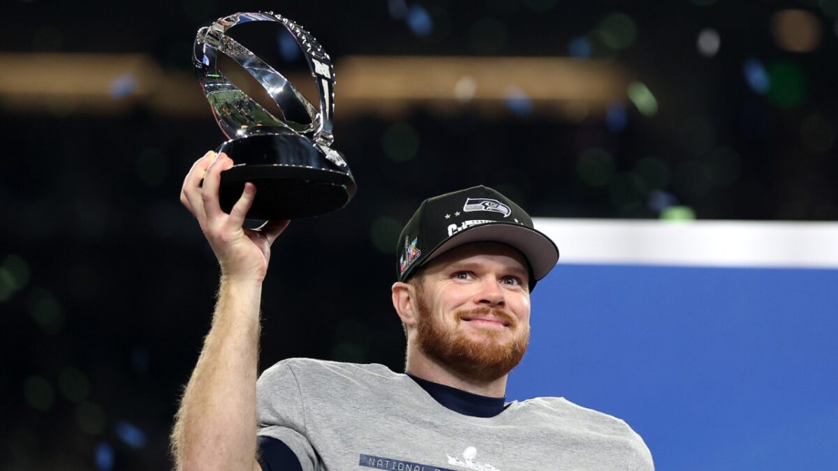 Sam Darnold with the NFC Championship trophy