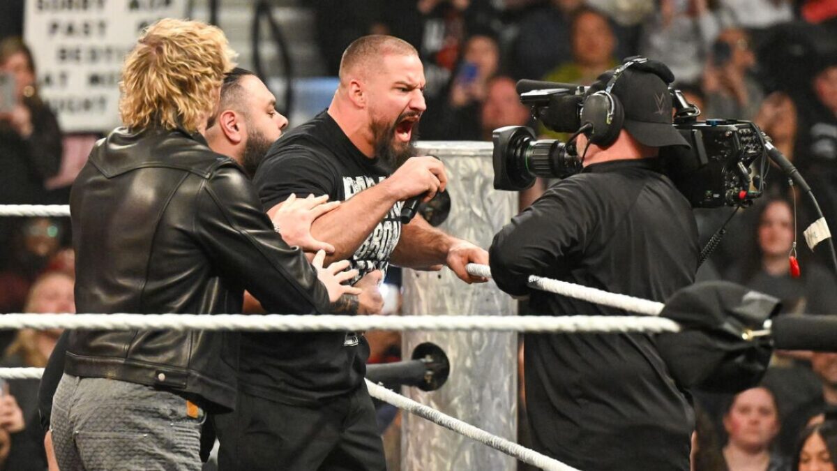 Vision members holding back Bron Breakker on Raw