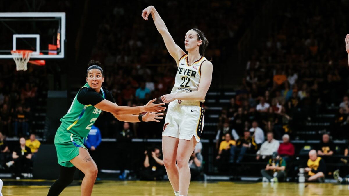 Caitlin Clark after launching from the logo