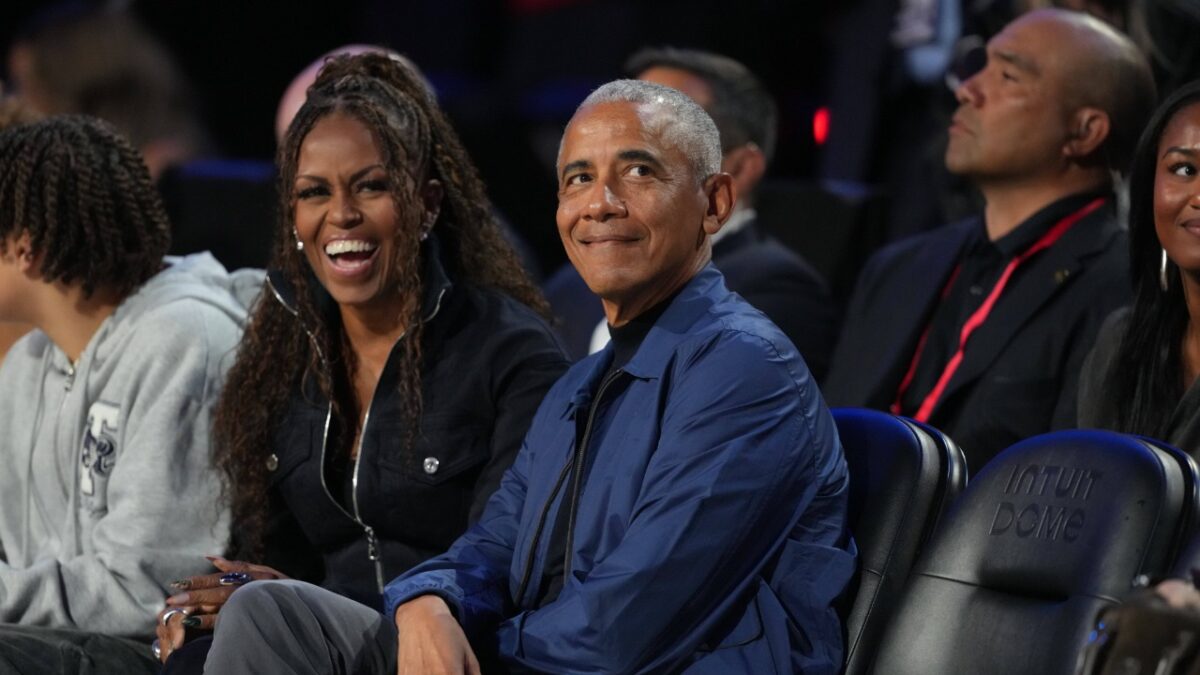 Michelle Obama and Barack Obama sitting courtside at 2026 All-Star game