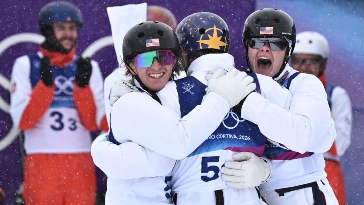 Team USA Breaks The Best-Ever Winter Olympic Performance Following Anti-ICE Advocate Chris Lillis’ Finishing Jump To Retain Mixed Aerials Gold 1 Connor Curran, Chris Lillis, Kaila Kuhn celebrate after Lillis' jump (Image via @usskiteam on X)