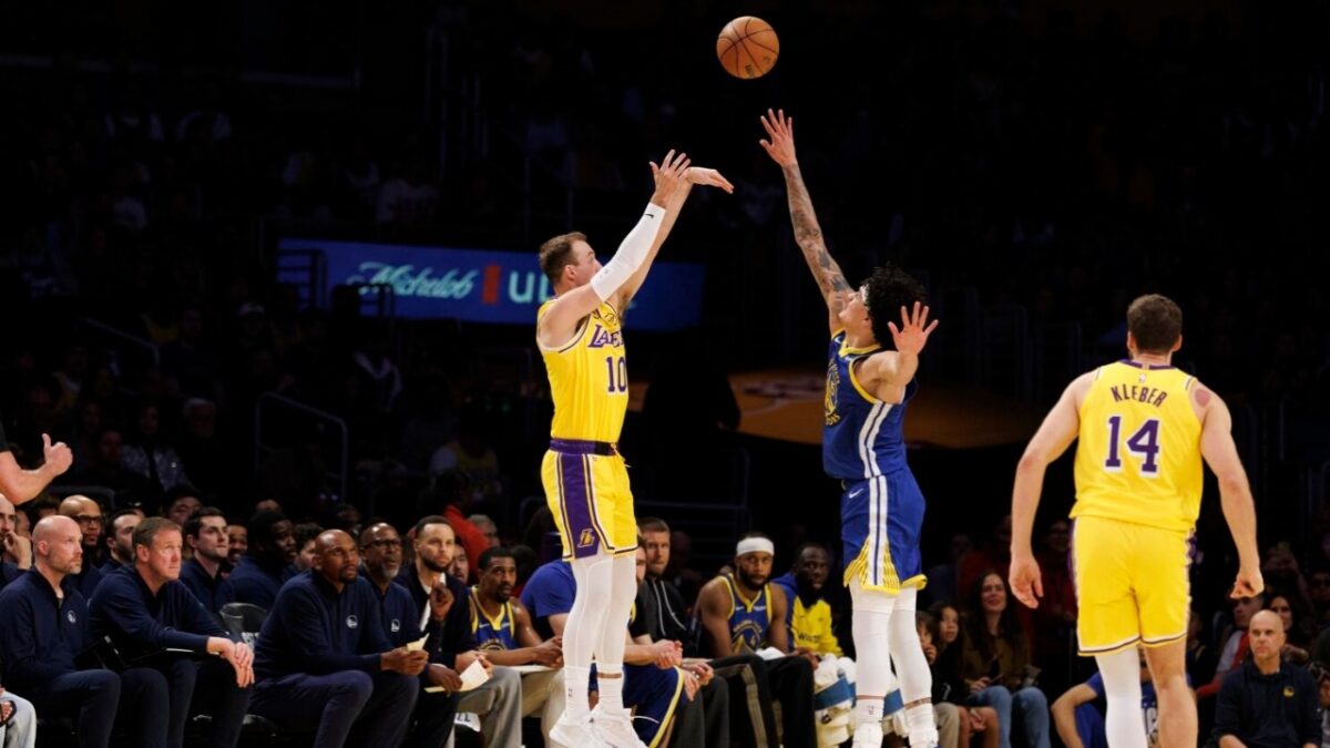 Luke Kennard shooting over Gui Santos