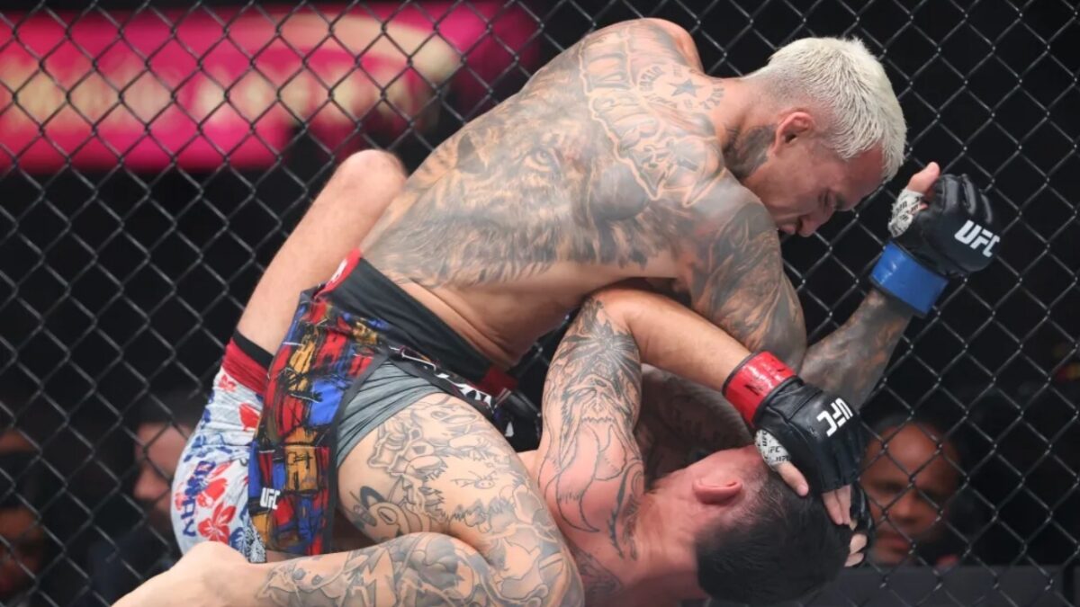 Charles Oliveira dominating Max Holloway at UFC 326