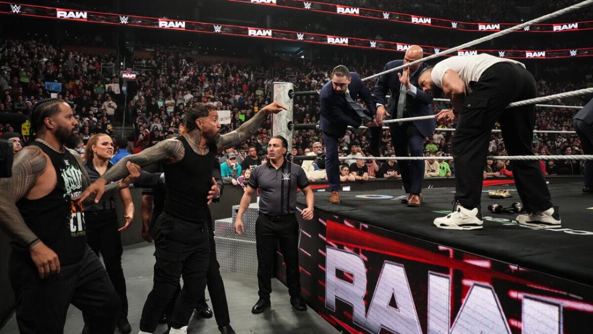 Jey Uso imploring Roman Reigns to beat CM Punk up